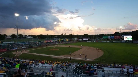 Time lapse of storm clouds over minor league baseball game Stockbeeldmateriaal 77577088