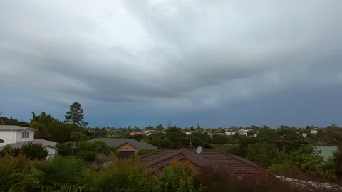 Time lapse storm clouds pass over west Auckland suburbs Stock Footage 110030109