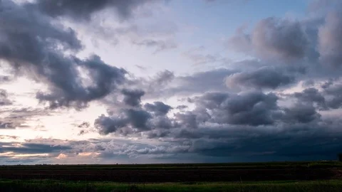 Time Lapse of Storm Clouds Passing Over A Rice Farm Stock Footage 106168061