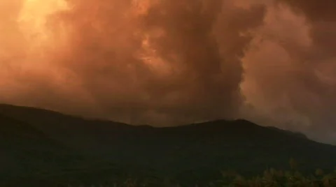 Time-lapse storm clouds rising over mountain Stock Footage 309773
