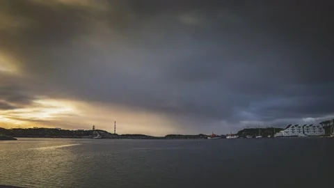 Time lapse of storm clouds in a small harbor off the coast of norway Stock Footage 145852842