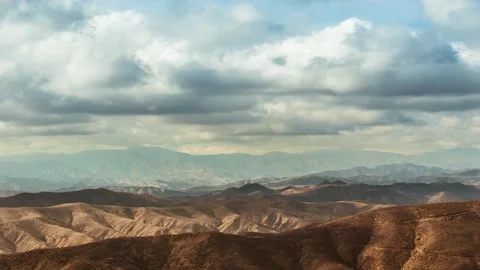 Time lapse storm clouds travel over mountains Stock Footage 246172393