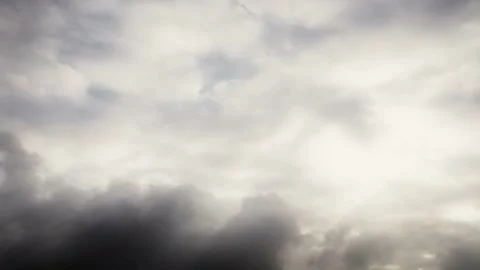 Time lapse storm clouds travel across a dark sky (loop) Stock Footage 246172457