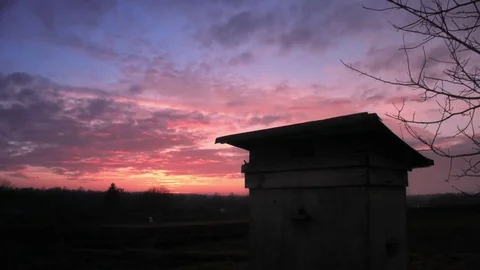 Time lapse storm evening clouds moving over the field Stock Footage 84819982