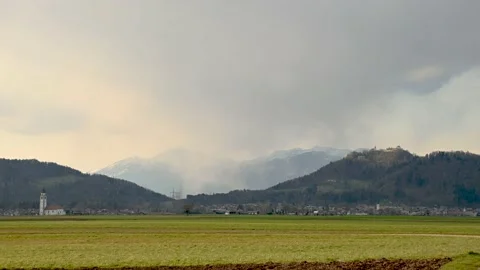 Time lapse storm over Alps mountains and farming fields in Slovenia Stock Footage 152451724