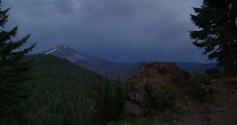 Time-lapse of storm over Mt. Jefferson suddenly giving way to sun beam Stock Footage 127738163