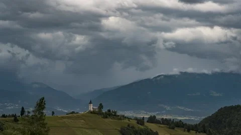 Time lapse of a storm with strong wind forming over the famous Jamnik church Stock Footage 246864758