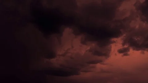 Time-lapse stormclouds in a red sky with forked lightning effects Stock Footage