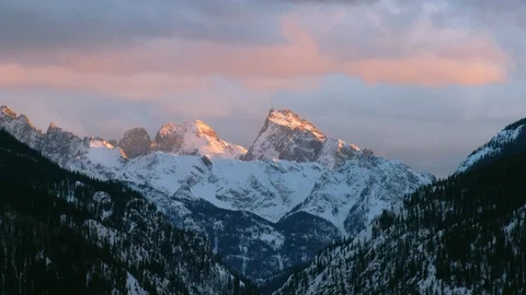 Time-lapse of stormy clouds moving over snow clad mountain range Stock Footage 116786090