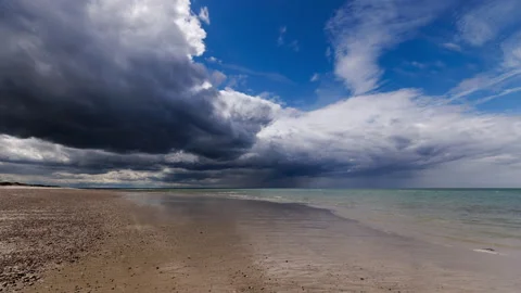 Time Lapse of Stormy Clouds Moving Over Beach Stock Footage 311391089
