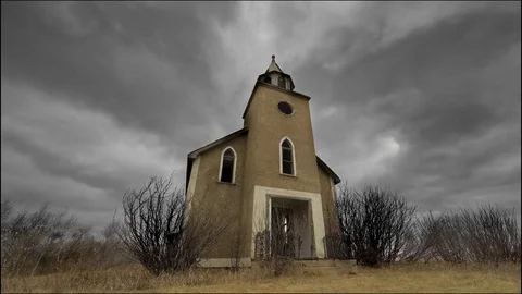 Time lapse of stormy clouds over an abandoned church Stock Footage