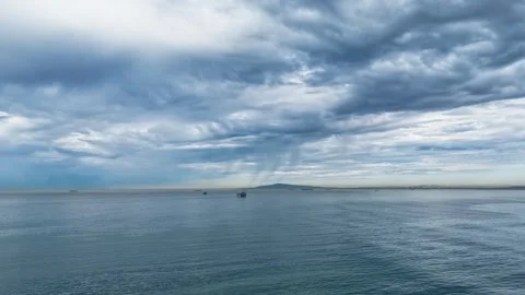 Time Lapse stormy Clouds over Huntington Beach offshore Drilling Rig. Stock Footage 345715704
