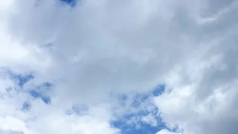 Time lapse with a stormy dark sky turning into a light blue sky Stock Footage 141809335