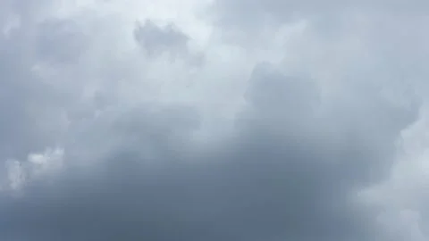 Time lapse with a stormy dark sky turning into a light blue sky Stock Footage 141809622