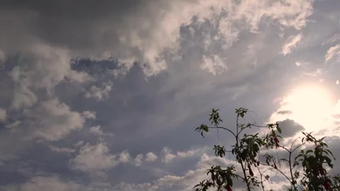 Time lapse of stormy dense clouds gathering and passing over the forest and f Stock Footage 274681980