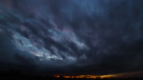 Time lapse of strong movement from the wind of dark clouds across the sky on a Stock Footage 146473159