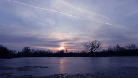 Time lapse of strong movement from the wind of dark clouds across the sky on a 動画素材 146473578