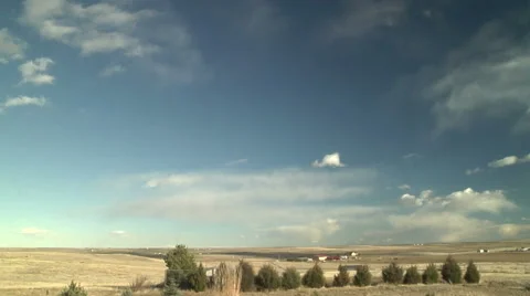 Time Lapse of Strong Winds Clearing Away Clouds over the Plains Stock Footage 54722796