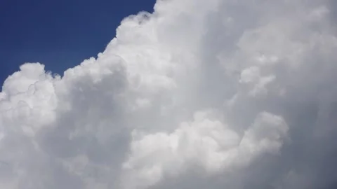 Time-lapse of stunning white thunderclouds gradually filling the blue sky. Stock Footage 313503890