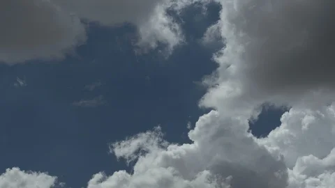 Time lapse of summer cumulus clouds closing in the sky Stock Footage 113820113