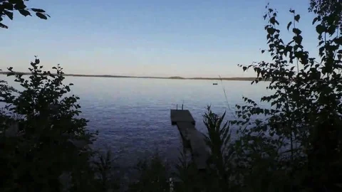 Time lapse of a summer late night in a lake in Finland Video stock 69098260