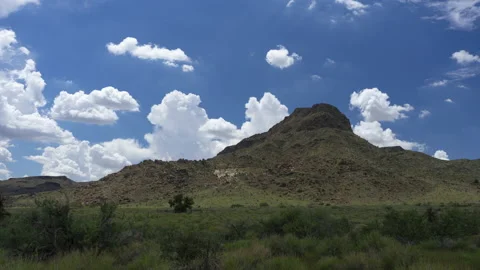 Time lapse of summer monsoon clouds building over a desert mountain Stock Footage 205929196