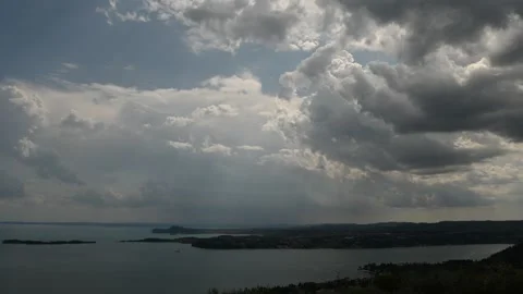 Time lapse of summer storm clouds near a lake Stock Footage 340968751