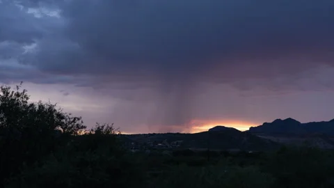 Time lapse of a summer storm over a small town in the southwest Stock Footage 246800951