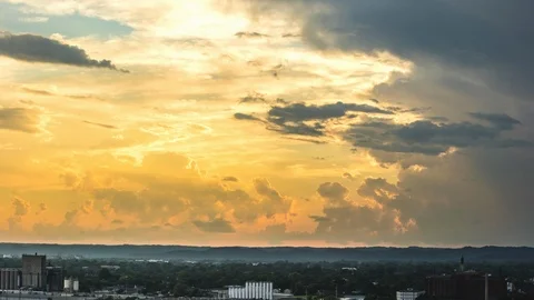 Time Lapse of Sun and Clouds Moving over Midwestern City during Magic Hour Stock Footage 95452096