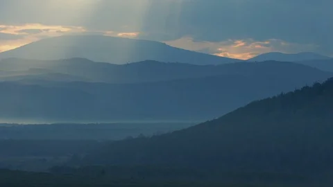 Time lapse of sun beams through clouds and rising sun Stock Footage 78588798