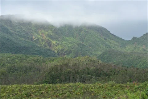Time lapse of sun cutting though clouds on mountain Stockbeeldmateriaal 91143765