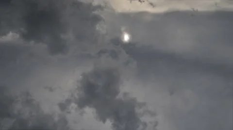 Time lapse sun in dark clouds Stock Footage 51476356