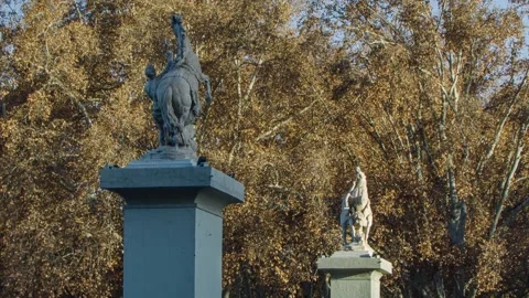 Time lapse of the sun going down over the Marly horses. Stock Footage 137357878