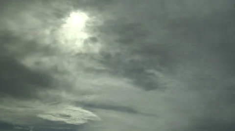 Time Lapse of Sun Hiding Behind Fast Moving Clouds Stock Footage 54719593