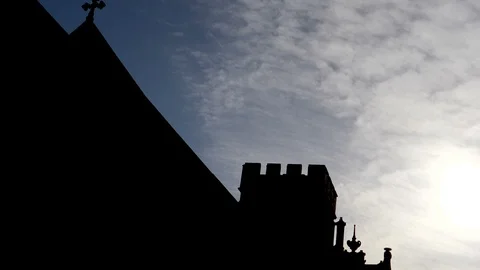 Time Lapse-Sun-lit clouds over stone church silhouette-Edinburgh Scotland Stock Footage 96342019