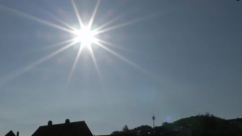 Time Lapse: The sun moving in the sky above rural village, clouds, birds, jets Stock Footage 90515081