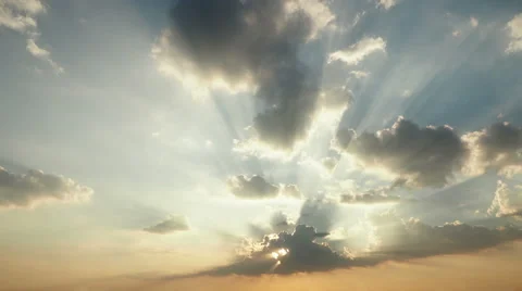 Time lapse of sun rays emerging though the clouds running billowing. Stock Footage 49298325