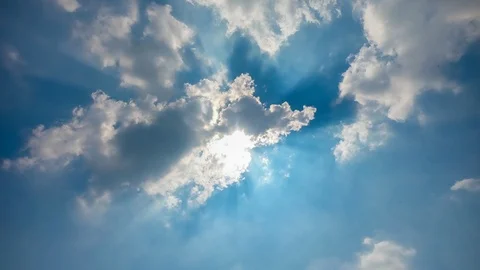 Time lapse Sun rays  through the cloud on the blue sky Stock Footage 118624808