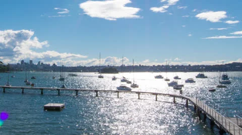 Time Lapse of sun reflecting on harbour with boats 121GYDB NTSC Stock Footage 26382666