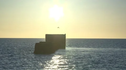 Time lapse sun rise over sea outfall Stock Footage 7755103