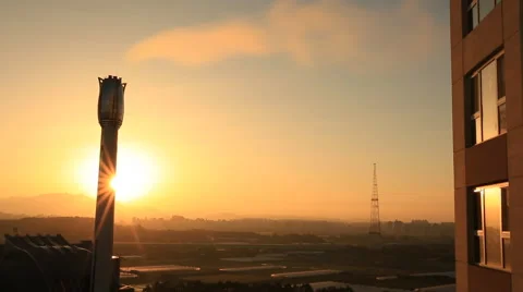 Time lapse of Sun rising behind chimney of factory Stock Footage 68223280