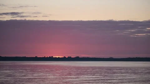 Time lapse with sun rising over a lake or river Video stock 68326127