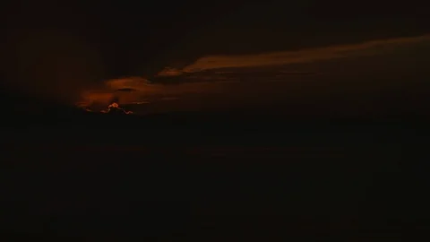 Time-lapse of sun rising over sea Stock Footage 117751428