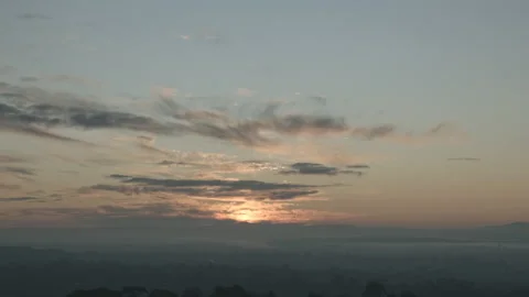 A time lapse of the sun rising over the mountains Stock Footage 232773387