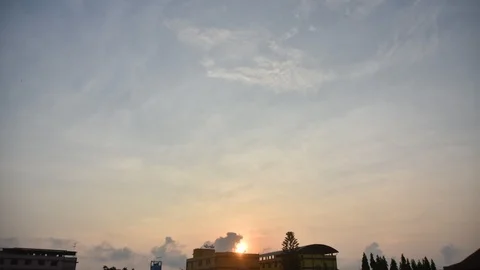 Time lapse The sun is rising in the sky in the morning. Through the buildings Stock Footage 88015627
