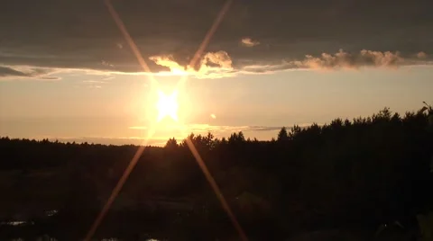 Time lapse sun set among the clouds Stockbeeldmateriaal 52512916