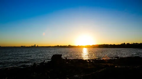 Time lapse of the sun setting behind the city of Montevideo. Stock Footage 26016908