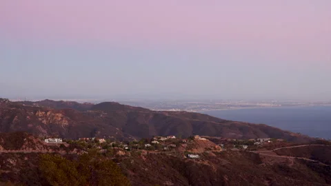 Time lapse of sun setting behind the horizon around picturesque coastal area Stock Footage 220758234