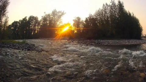 Time-lapse of sun setting over river near water Stock Footage 73051416