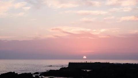 Time-lapse of sun setting over the majestic Atlantic Ocean in Porto, Portugal Stock Footage 114853435